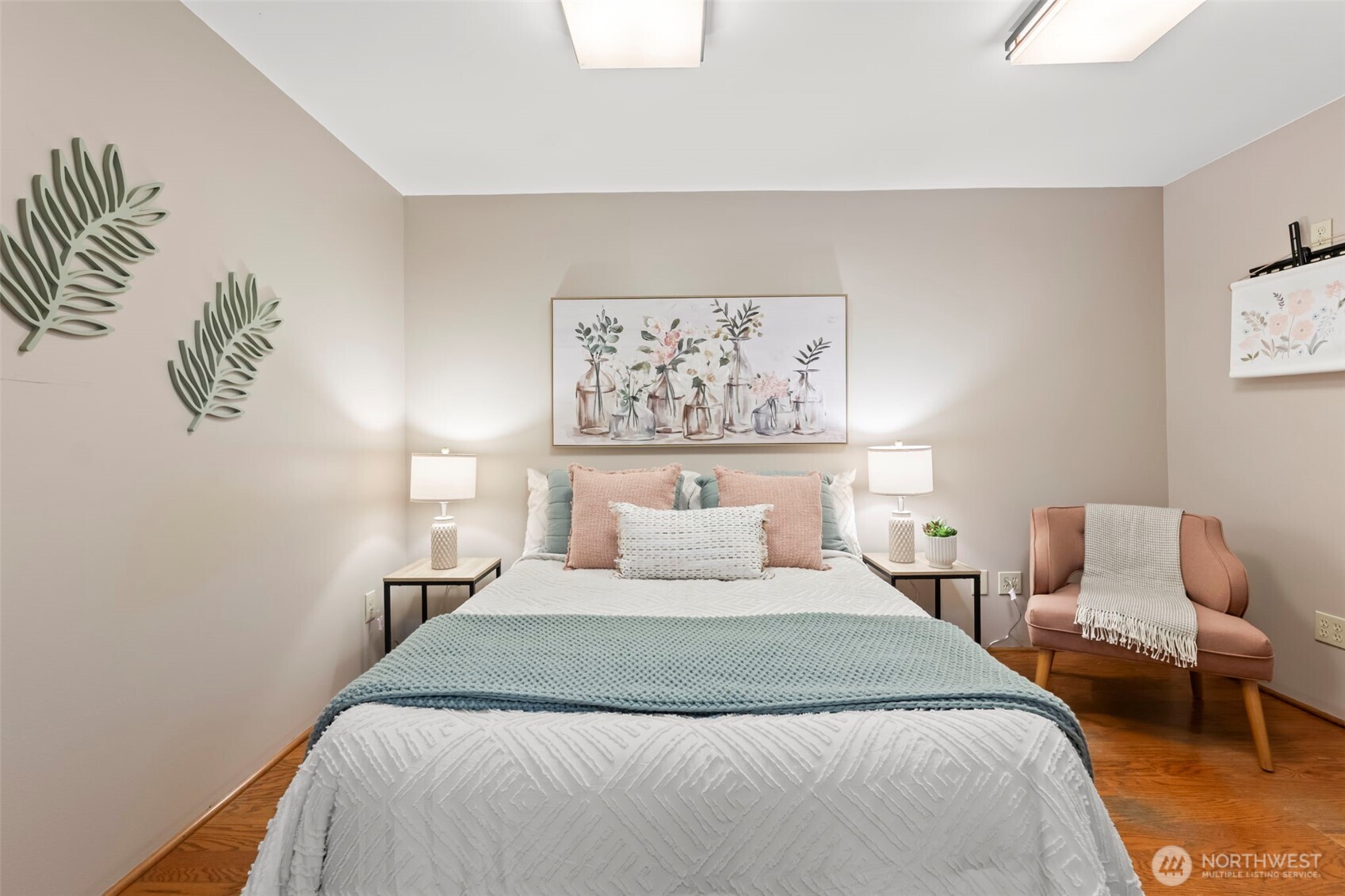 12170 Viewcrest Place Northeast Bainbridge Island, WA 98110 - Photo 27 of 37 a bedroom with a large bed and a couch