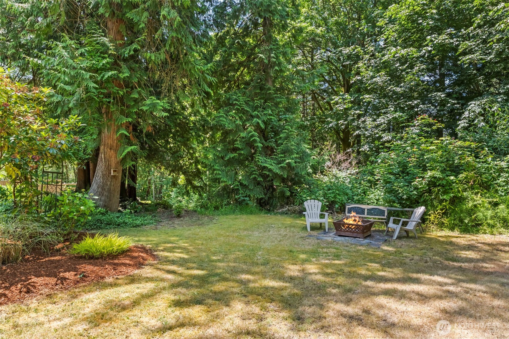 12170 Viewcrest Place Northeast Bainbridge Island, WA 98110 - Photo 34 of 37 a small garden covered with tall trees