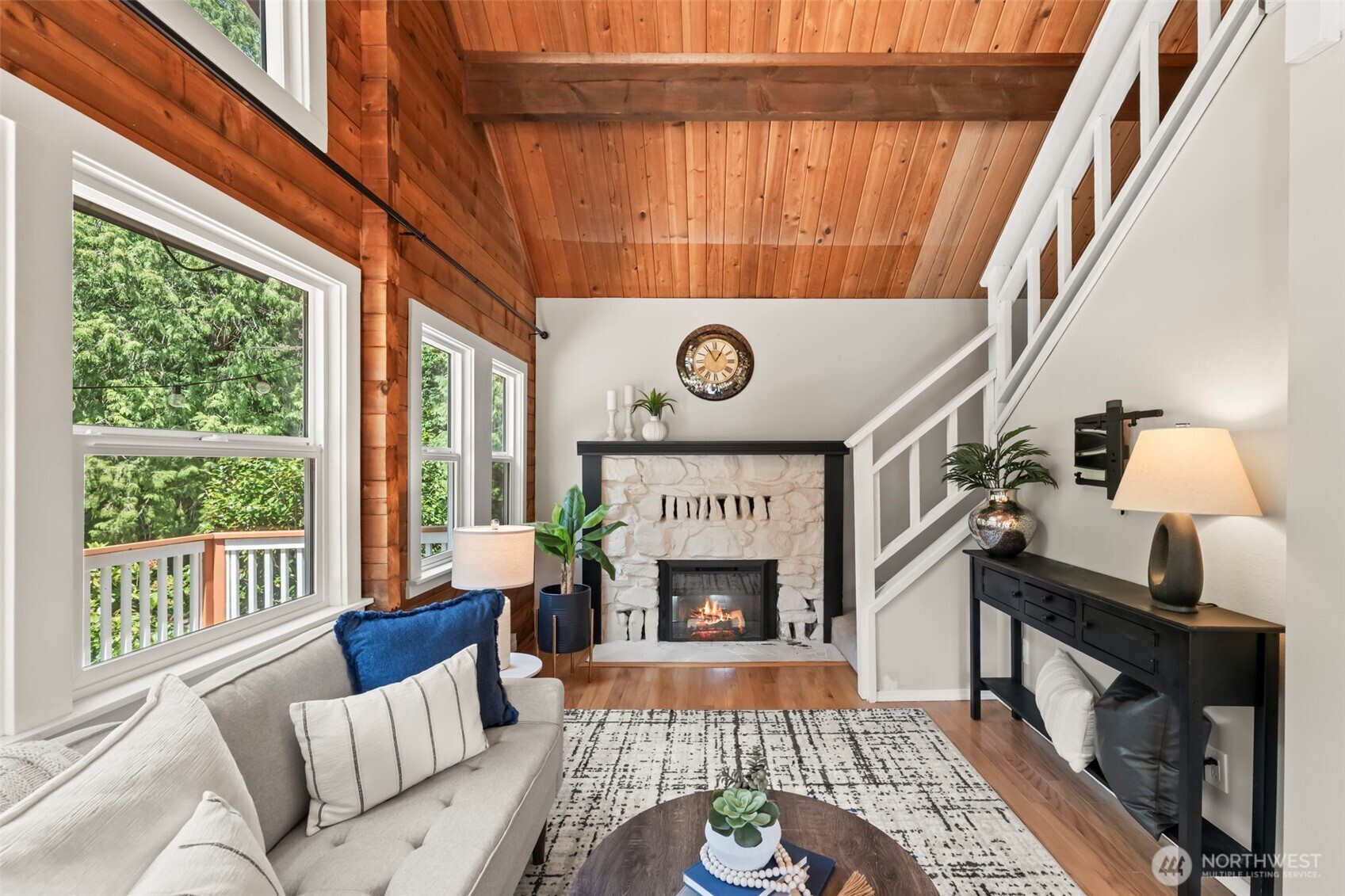 12170 Viewcrest Place Northeast Bainbridge Island, WA 98110 - Photo 4 of 37 a living room with furniture and a fireplace