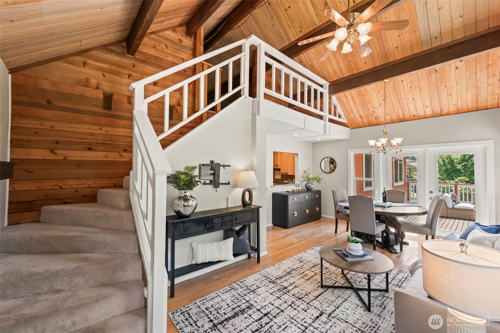 12170 Viewcrest Place Northeast Bainbridge Island, WA 98110 - Photo 6 of 37 a balcony with furniture