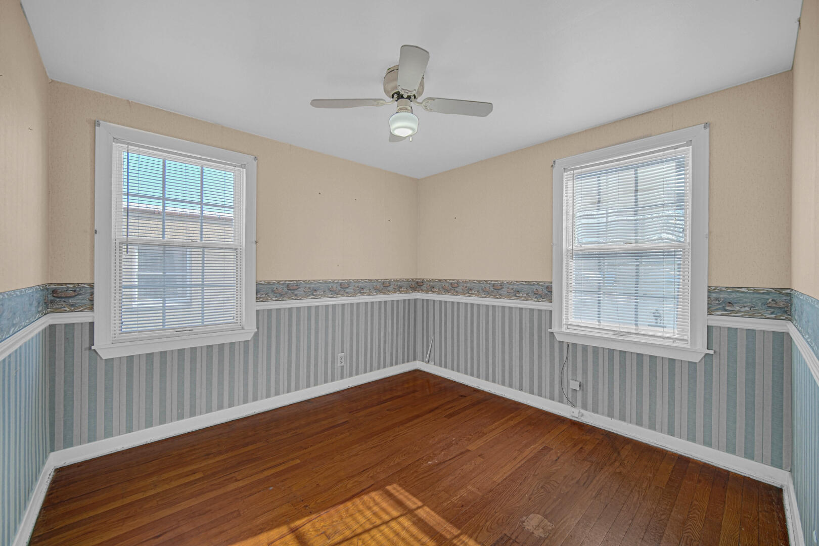 248 Adelaide Place Munster, IN 46321 - Photo 19 of 28 a view of an empty room with wooden floor and a window
