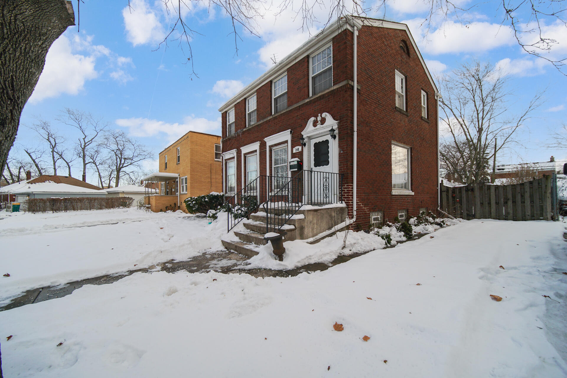 248 Adelaide Place Munster, IN 46321 - Photo 27 of 28 a view of a house with snow on the road