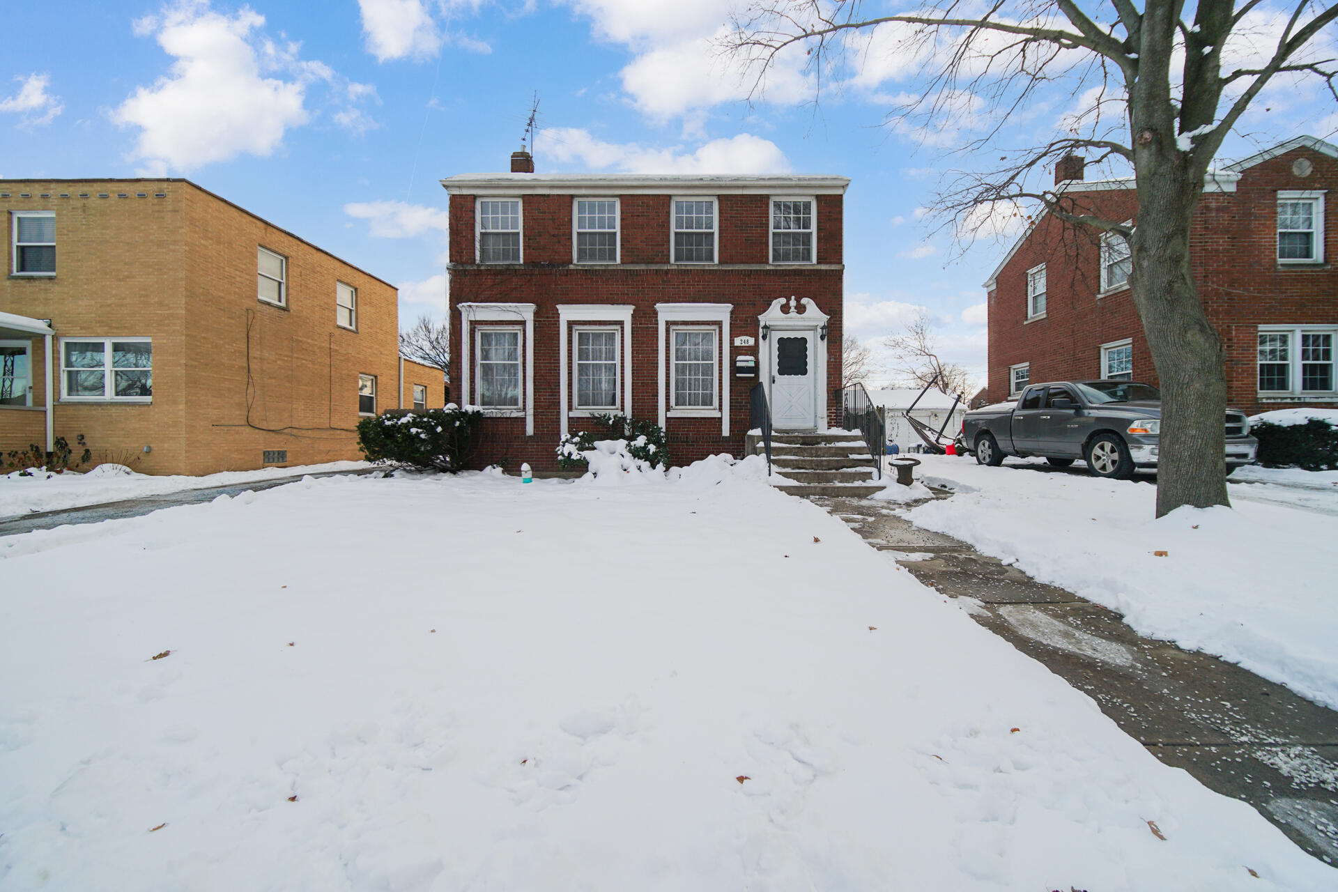 248 Adelaide Place Munster, IN 46321 - Photo 28 of 28 a view of a building with a snow on the road