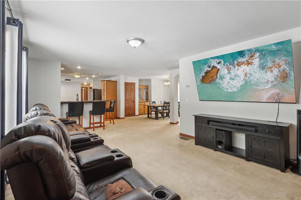 224 Toy Road Kittanning, PA 16201 - Photo 11 of 48 a living room with furniture a flat screen tv and a fireplace