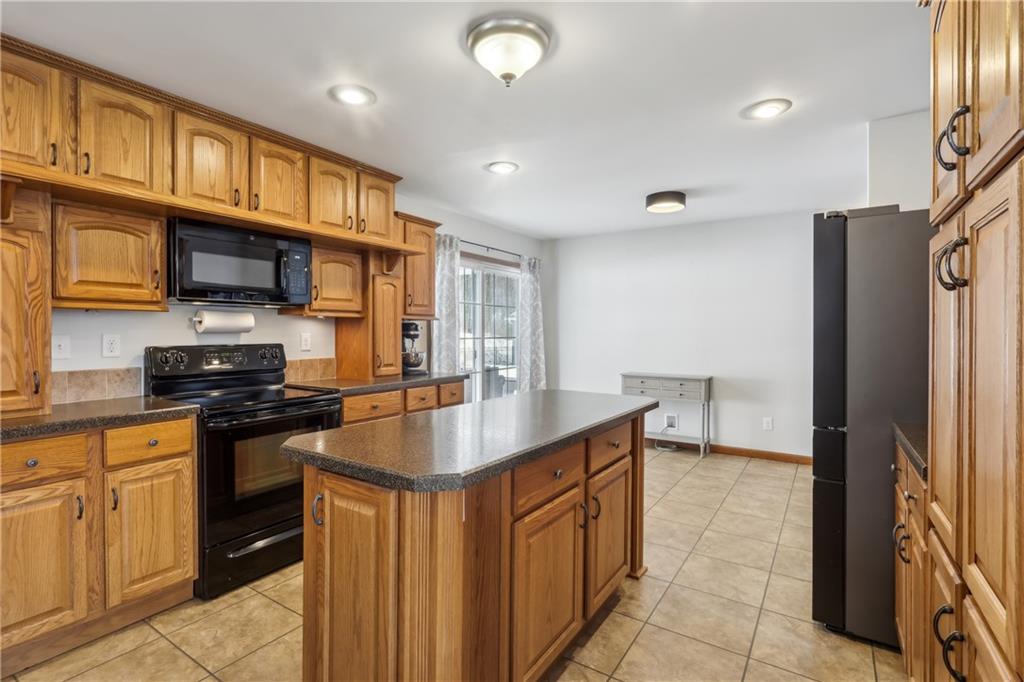 224 Toy Road Kittanning, PA 16201 - Photo 17 of 48 a kitchen with stainless steel appliances granite countertop a refrigerator a stove and a sink
