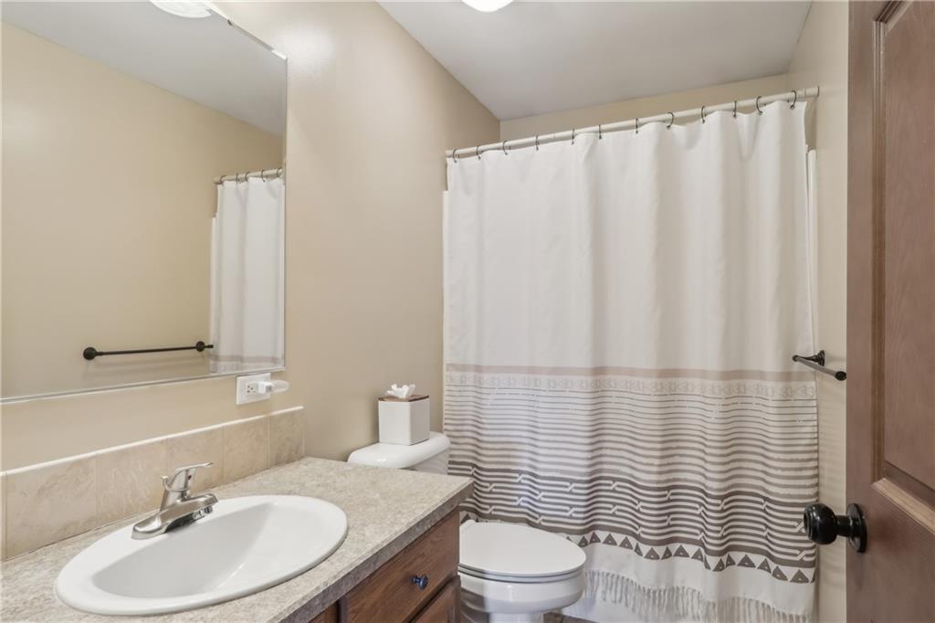 224 Toy Road Kittanning, PA 16201 - Photo 20 of 48 a bathroom with a sink a toilet and shower curtain