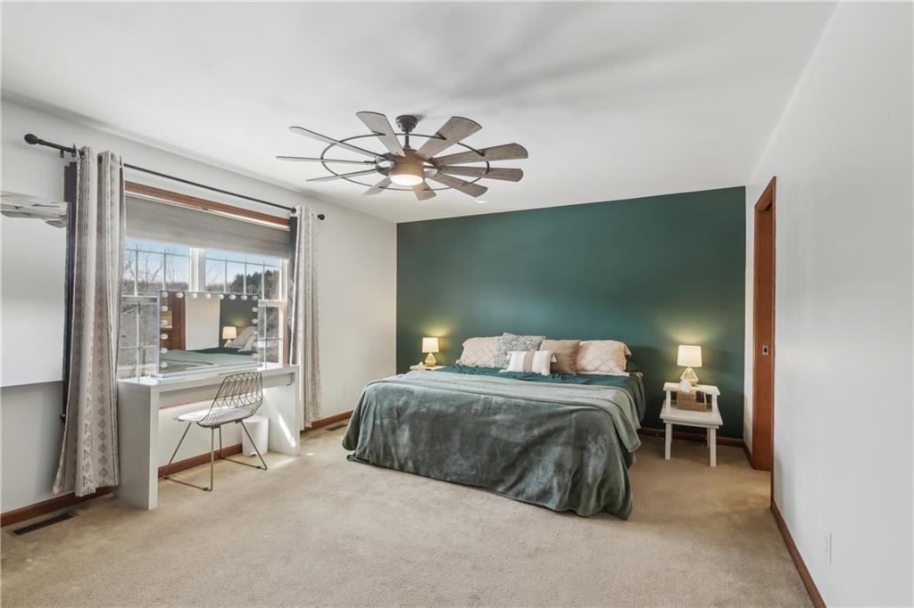 224 Toy Road Kittanning, PA 16201 - Photo 22 of 48 a bedroom with a bed and a chandelier