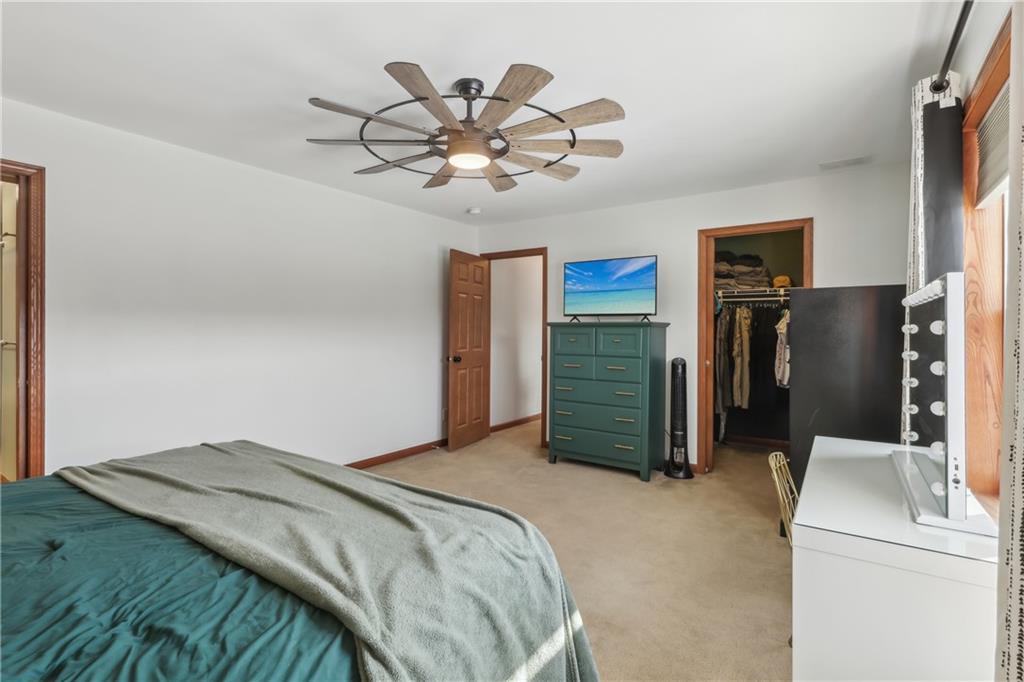 224 Toy Road Kittanning, PA 16201 - Photo 23 of 48 a bedroom with a bed and a chandelier