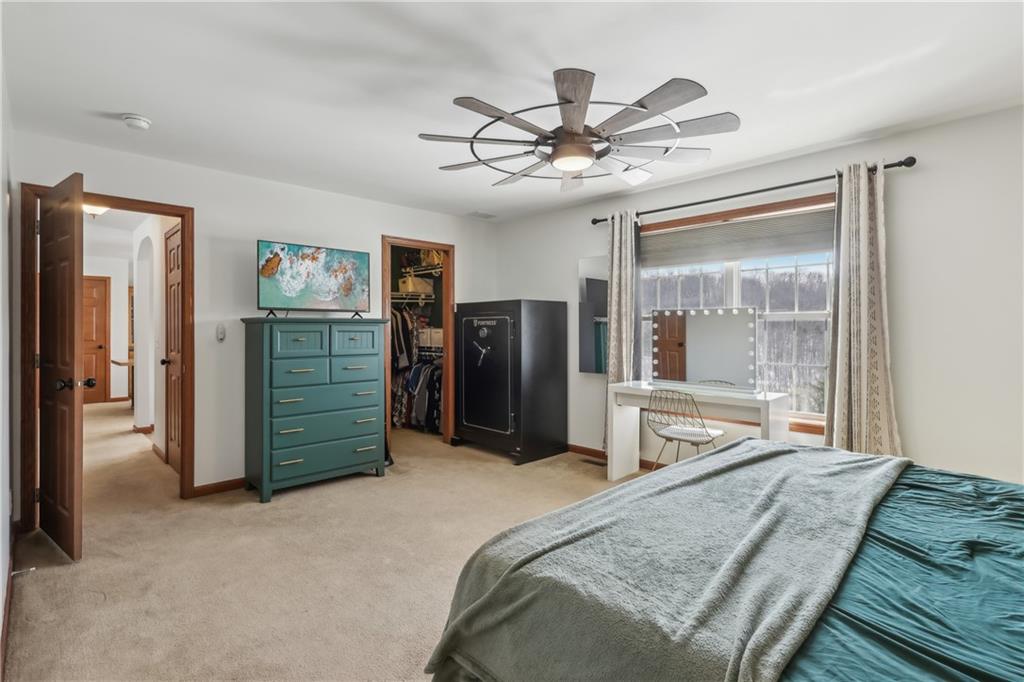 224 Toy Road Kittanning, PA 16201 - Photo 24 of 48 a bed room with a bed and a large mirror