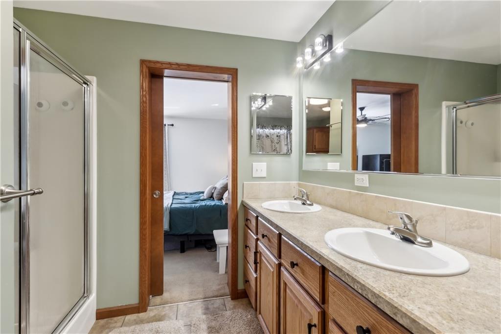 224 Toy Road Kittanning, PA 16201 - Photo 26 of 48 a en suite bathroom with a granite countertop sink and a mirror