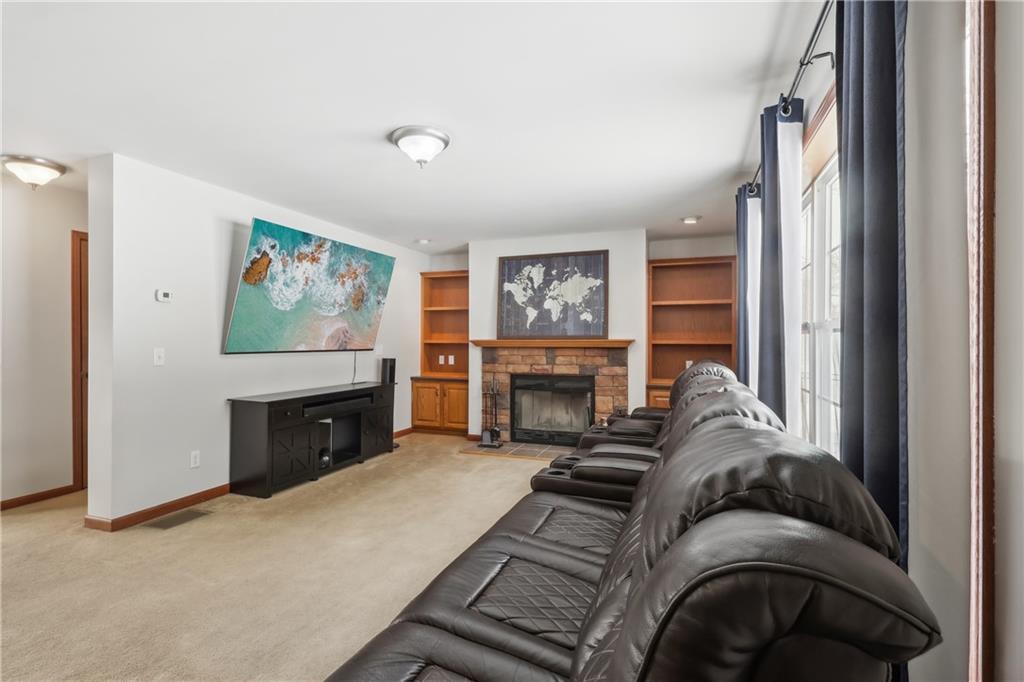 224 Toy Road Kittanning, PA 16201 - Photo 10 of 48 a living room with furniture a fireplace and a flat screen tv