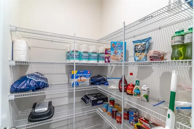 a dining room with furniture a chandelier and window