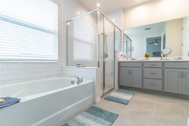a bathroom with a bathtub and a shower