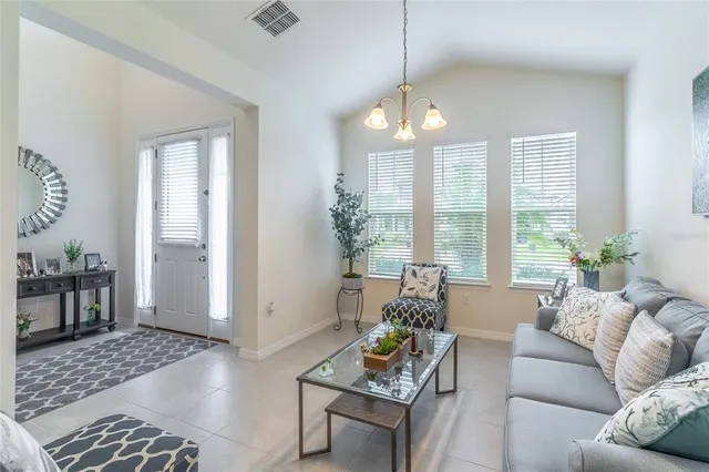 a kitchen with stainless steel appliances granite countertop a sink a stove and cabinets