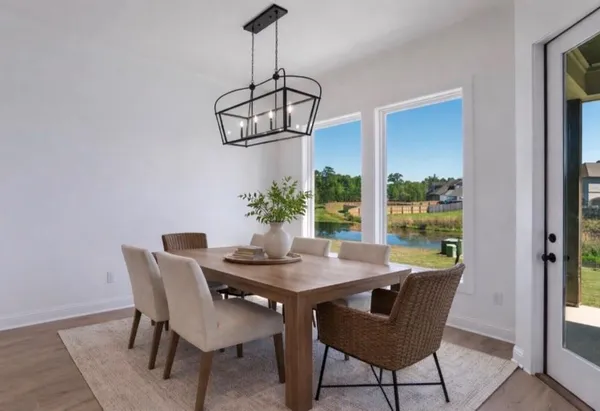 a room with a white cabinets and wooden floor