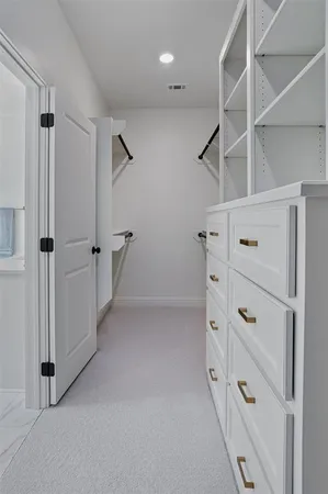 a bathroom with a double vanity sink toilet mirror and bathtub