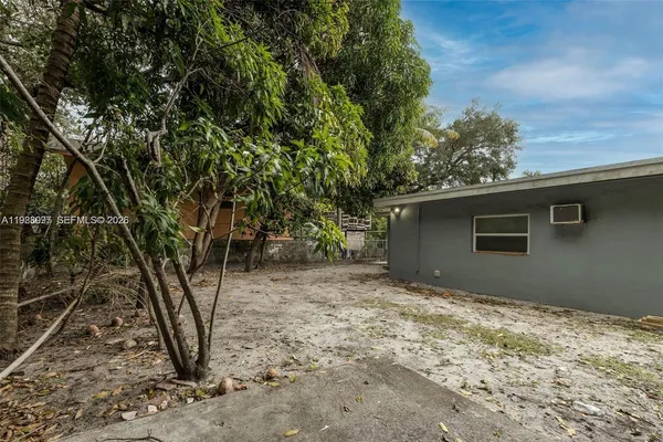 a view of a house with a tree