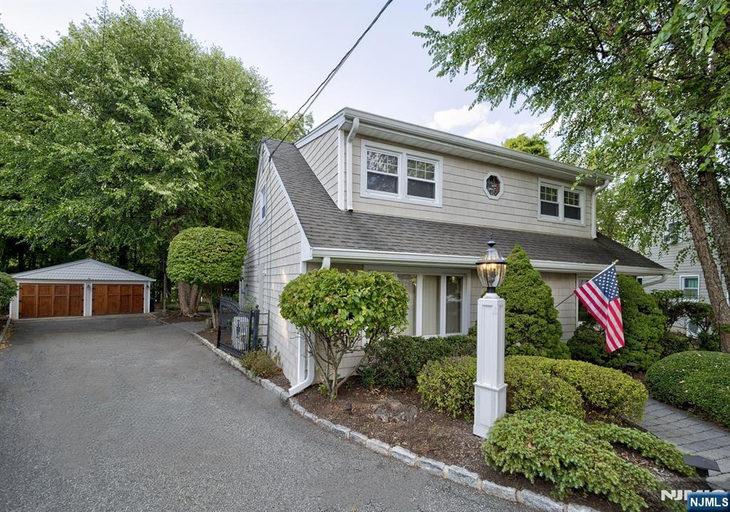 59 David Road Cedar Grove, NJ 07009 - Photo 1 of 24 a front view of a house with garden