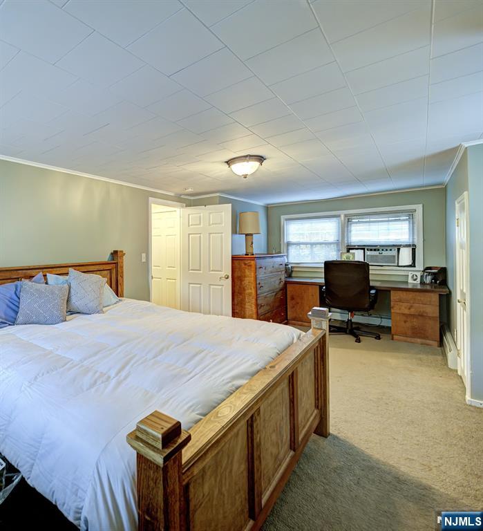 59 David Road Cedar Grove, NJ 07009 - Photo 16 of 24 a bed room with a bed and a chair