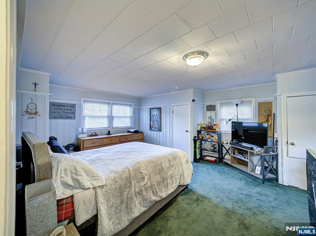 59 David Road Cedar Grove, NJ 07009 - Photo 17 of 24 a bedroom with bed and a flat tv screen