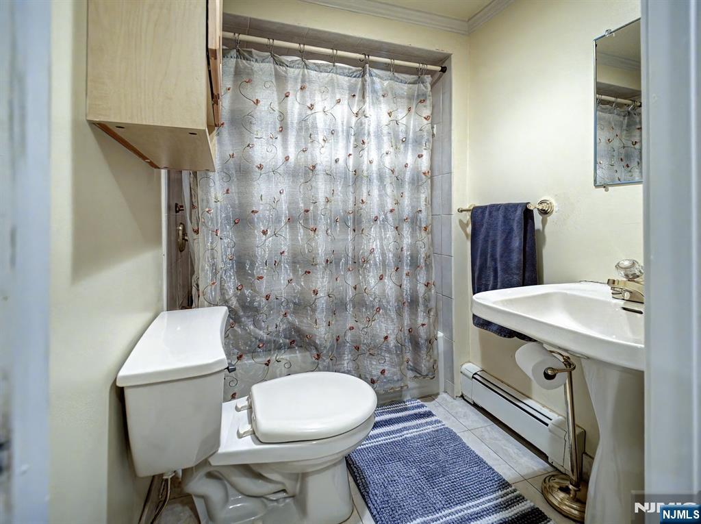 59 David Road Cedar Grove, NJ 07009 - Photo 19 of 24 a bathroom with a sink toilet and shower