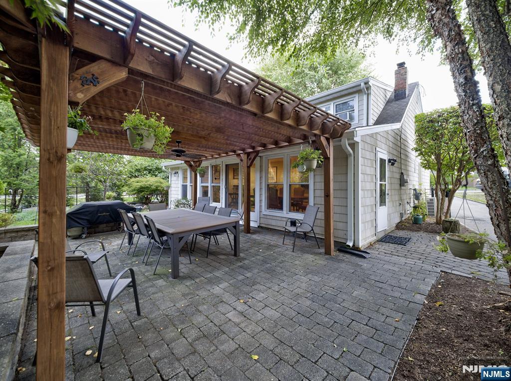 59 David Road Cedar Grove, NJ 07009 - Photo 21 of 24 a backyard of a house with table and chairs