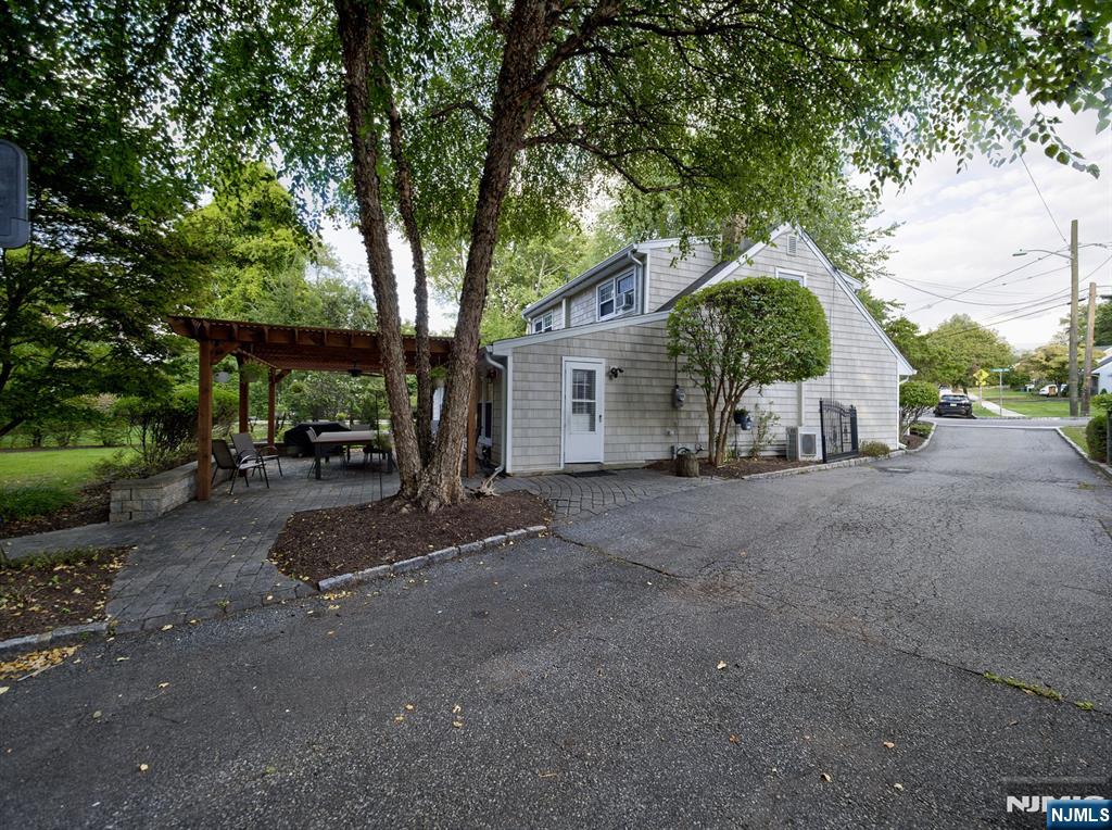 59 David Road Cedar Grove, NJ 07009 - Photo 23 of 24 a view of a street with a large trees