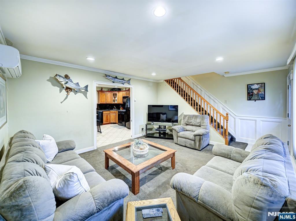 59 David Road Cedar Grove, NJ 07009 - Photo 3 of 24 a living room with furniture couches and a flat screen tv