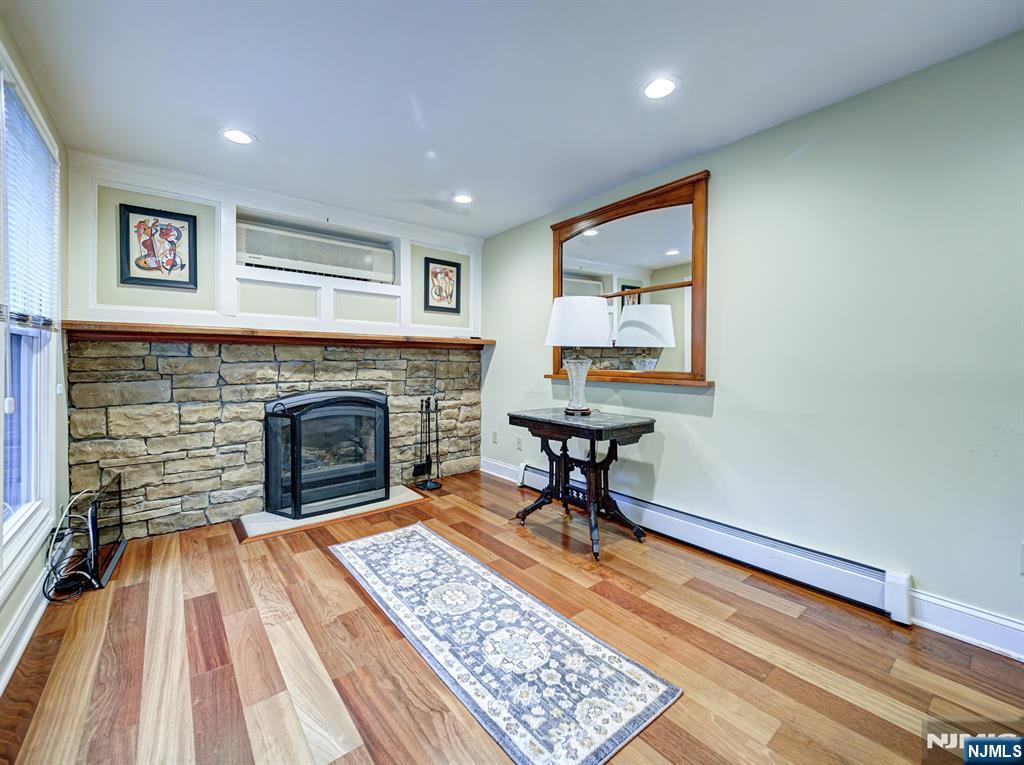 59 David Road Cedar Grove, NJ 07009 - Photo 9 of 24 a living room with furniture and a fireplace