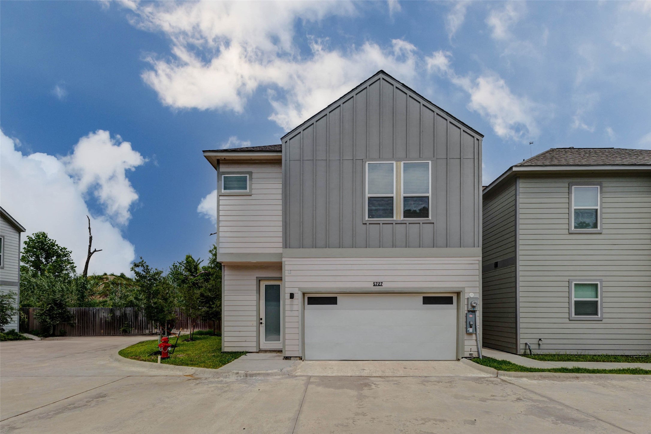 5705 Elysium Street Houston, TX 77091 - Photo 1 of 22 A clean and modern two-story exterior introduces the home with contemporary architectural lines, light-toned siding, and a crisp, fresh facade. The attached garage and double-wide driveway provide convenient off-street parking, while the compact subdivision lot offers a low-maintenance lifestyle.