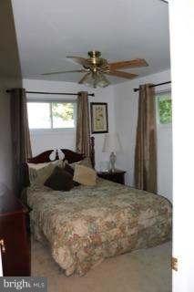 7410 Inzer Street Springfield, VA 22151 - Photo 11 of 30 a bedroom with a bed and window