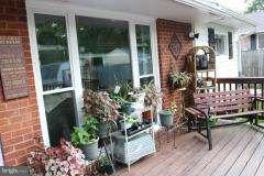 7410 Inzer Street Springfield, VA 22151 - Photo 18 of 30 a view of a porch with chairs and potted plants