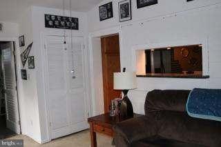 7410 Inzer Street Springfield, VA 22151 - Photo 25 of 30 a living room with furniture and a lamp