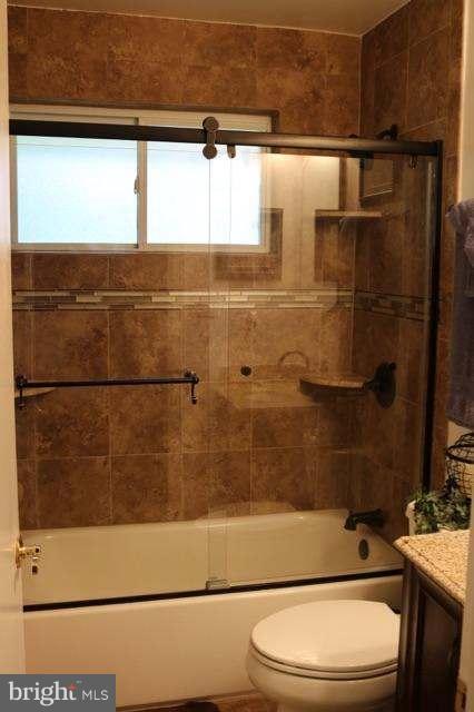 7410 Inzer Street Springfield, VA 22151 - Photo 26 of 30 a bathroom with a toilet a sink and a shower
