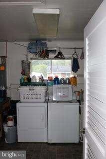 7410 Inzer Street Springfield, VA 22151 - Photo 30 of 30 a kitchen with a stove and cabinets
