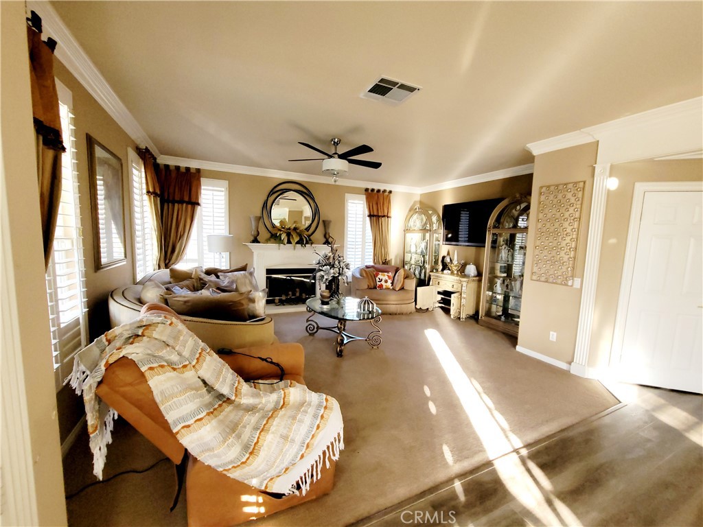 14119 Ashton Lane Riverside, CA 92508 - Photo 23 of 47 a living room with furniture and a large window