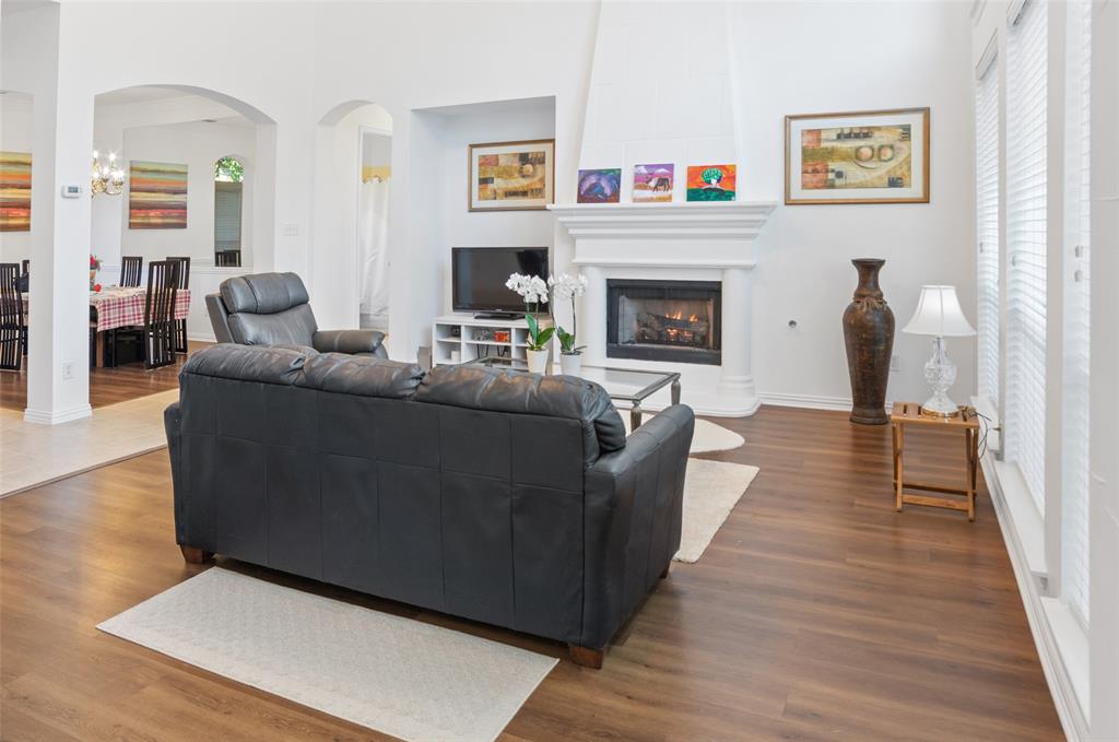 1818 Port Isabel Drive Allen, TX 75013 - Photo 11 of 38 a living room with furniture and a fireplace
