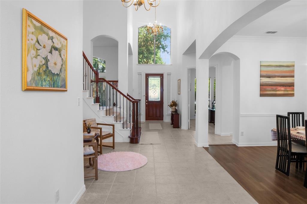 1818 Port Isabel Drive Allen, TX 75013 - Photo 13 of 38 a hallway with furniture and a wooden floor