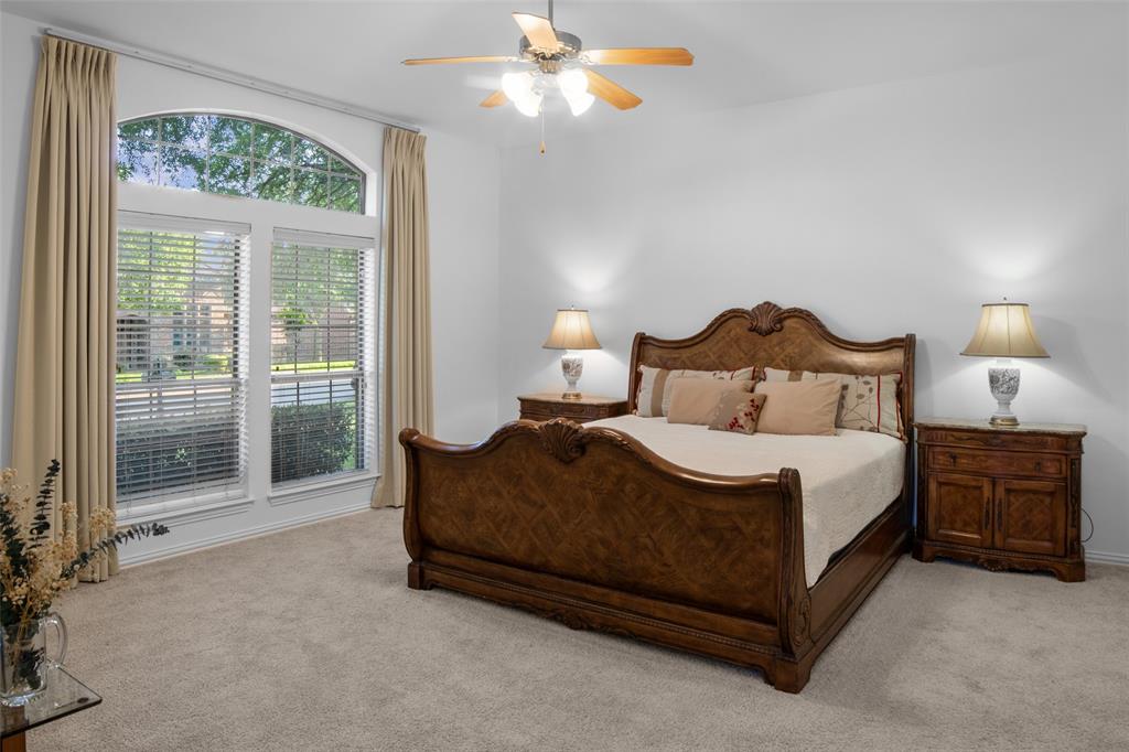 1818 Port Isabel Drive Allen, TX 75013 - Photo 15 of 38 a bedroom with a bed lamp and window