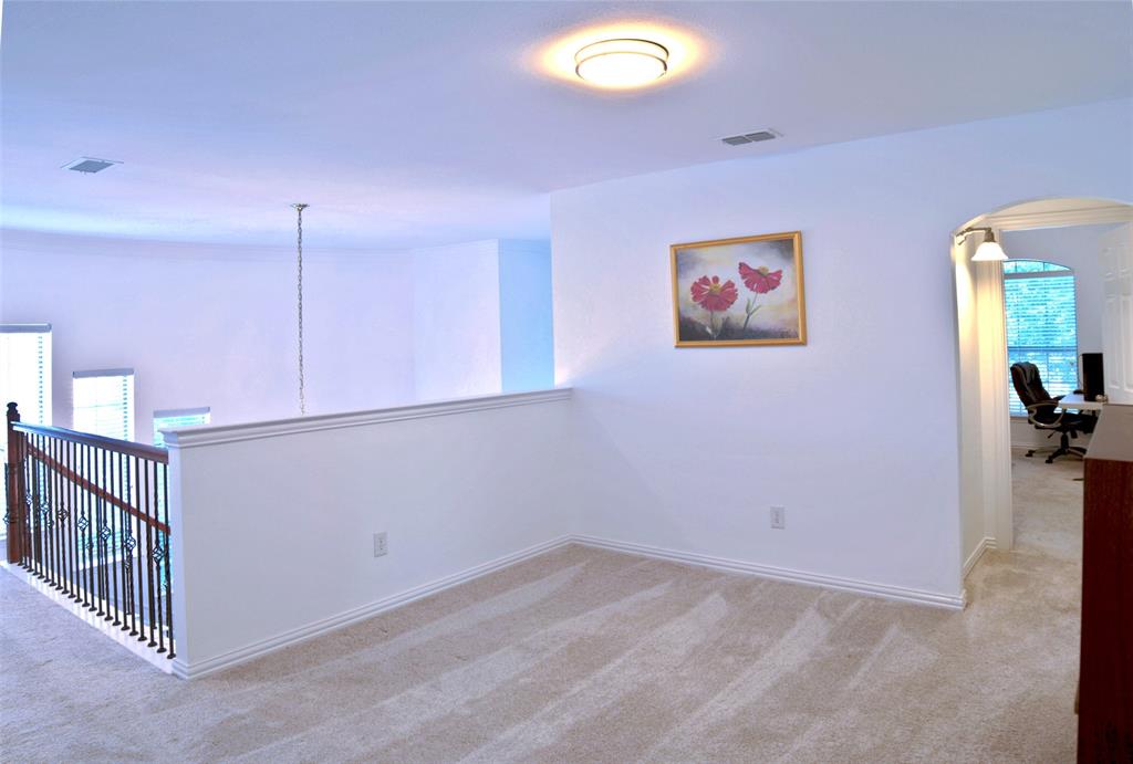 1818 Port Isabel Drive Allen, TX 75013 - Photo 20 of 38 a view of a room with a fan