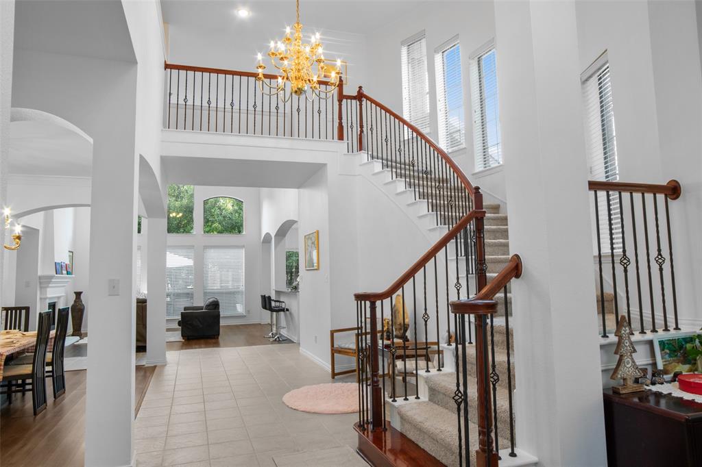 1818 Port Isabel Drive Allen, TX 75013 - Photo 3 of 38 a view of entryway livingroom and hall with wooden floor