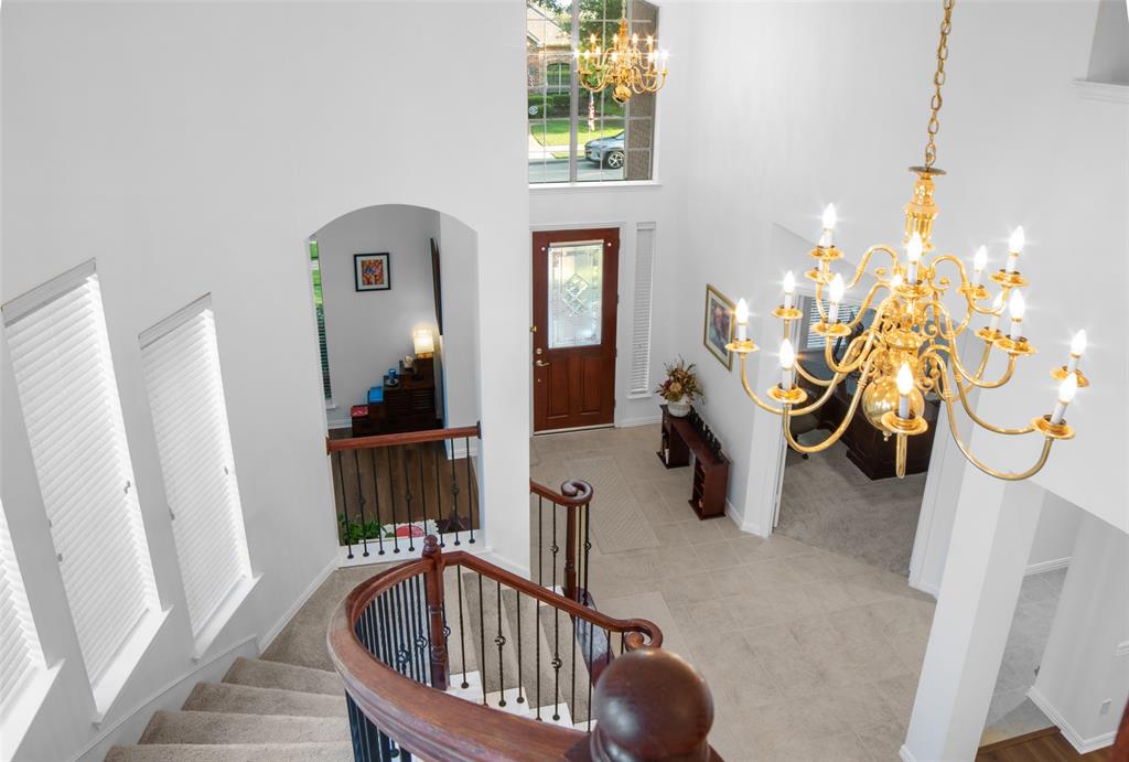 1818 Port Isabel Drive Allen, TX 75013 - Photo 31 of 38 a bedroom with furniture and a staircase