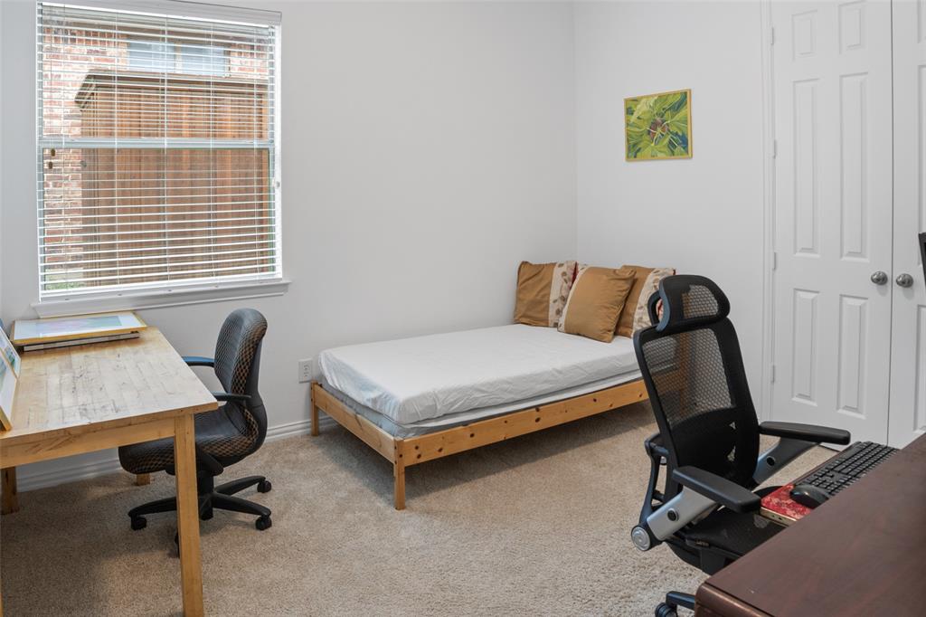 1818 Port Isabel Drive Allen, TX 75013 - Photo 32 of 38 a bedroom with a workspace