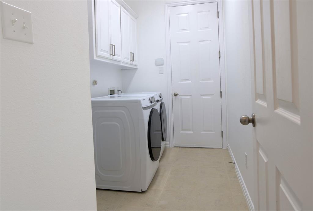 1818 Port Isabel Drive Allen, TX 75013 - Photo 34 of 38 a utility room with dryer and washer