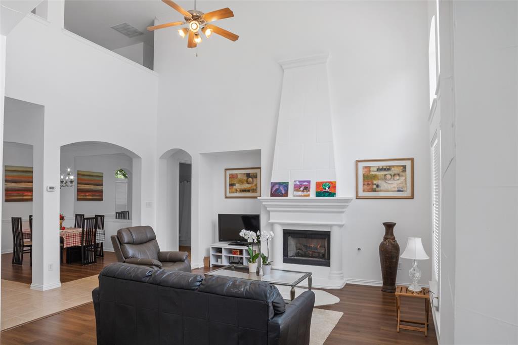 1818 Port Isabel Drive Allen, TX 75013 - Photo 10 of 38 a living room with fireplace furniture and a fireplace