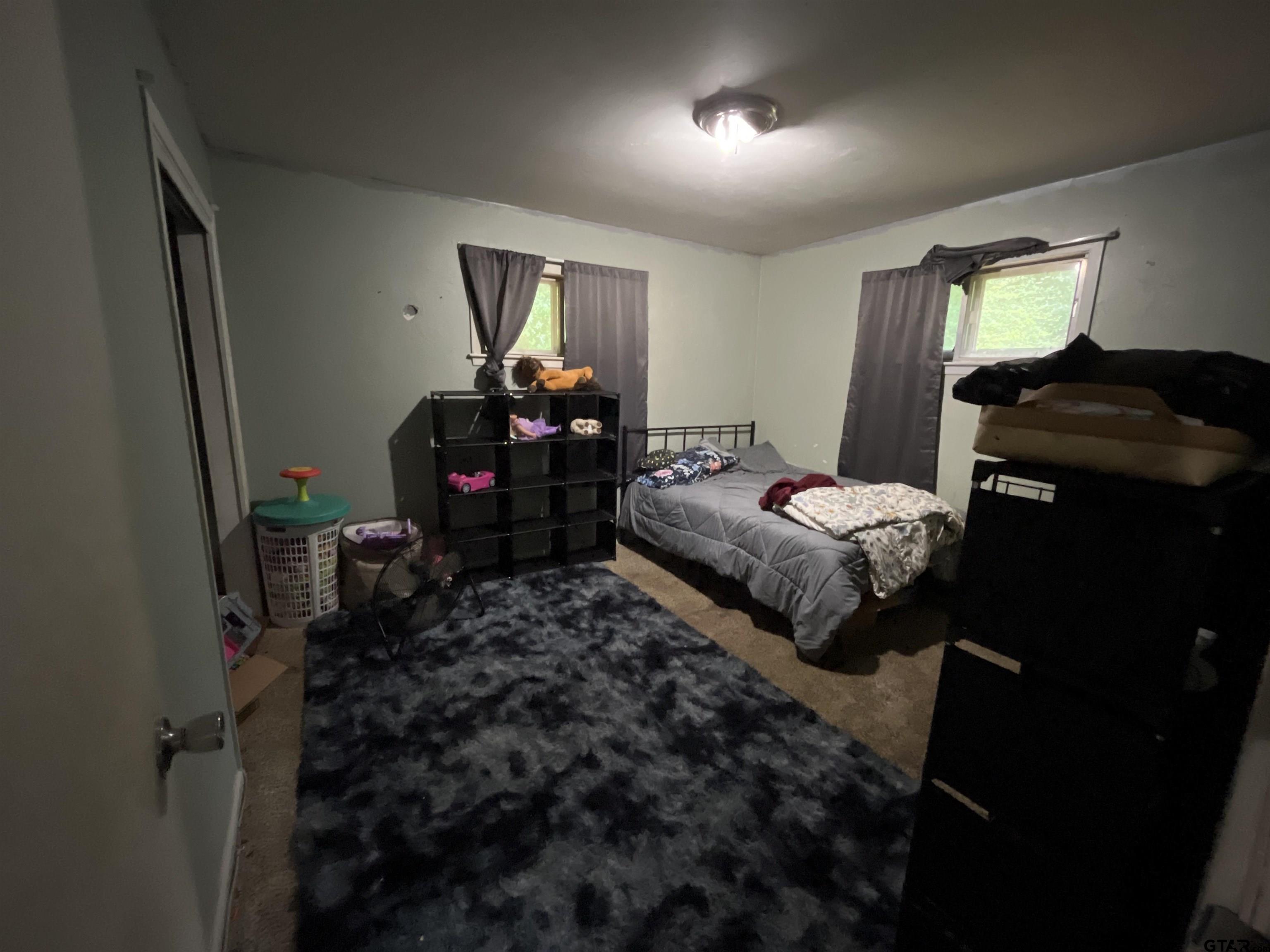124 Pinecrest Drive North Rusk, TX 75785 - Photo 15 of 18 a bedroom with bed and a window