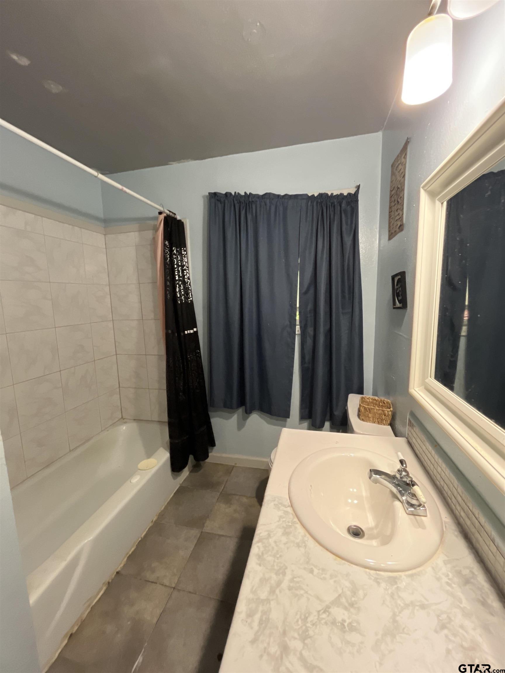 124 Pinecrest Drive North Rusk, TX 75785 - Photo 17 of 18 a bathroom with a sink and a mirror