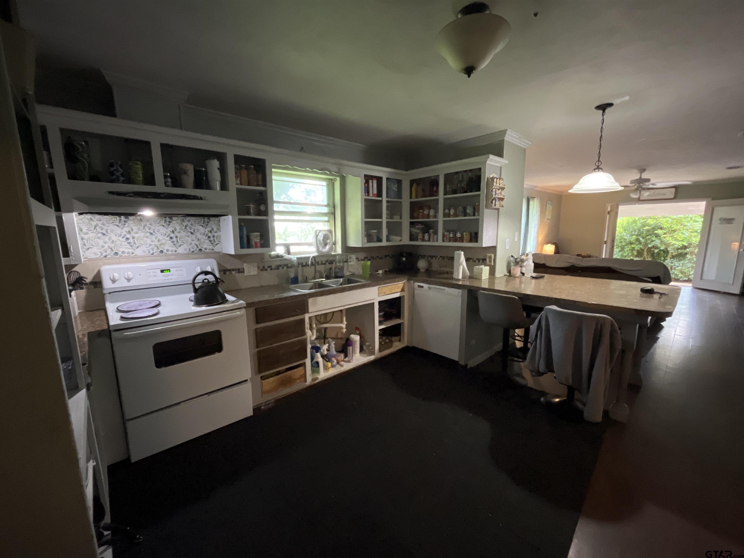 124 Pinecrest Drive North Rusk, TX 75785 - Photo 6 of 18 a kitchen with a stove and a sink