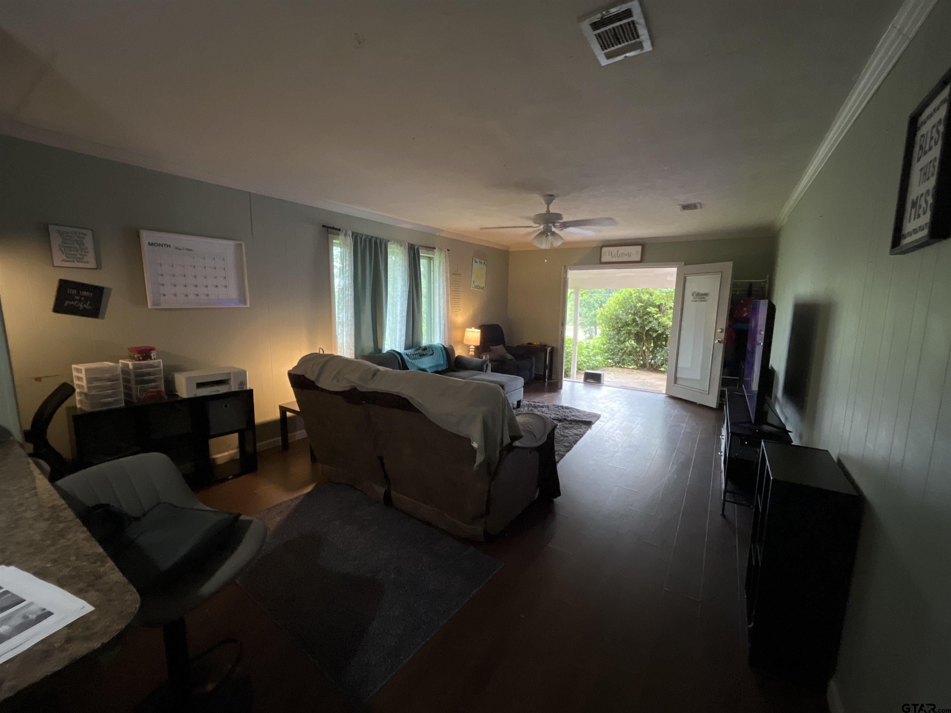 124 Pinecrest Drive North Rusk, TX 75785 - Photo 8 of 18 a living room with furniture and a flat screen tv