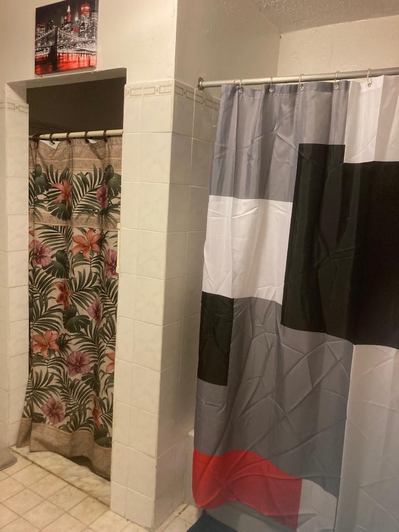 120 West 22nd Street Riviera Beach, FL 33404 - Photo 5 of 7 a view of walk in closet with clothes